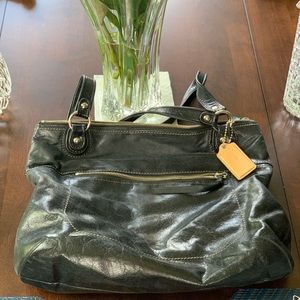 This is a Coach, black leather tote bag.